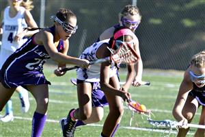 A girls lacrosse game in action